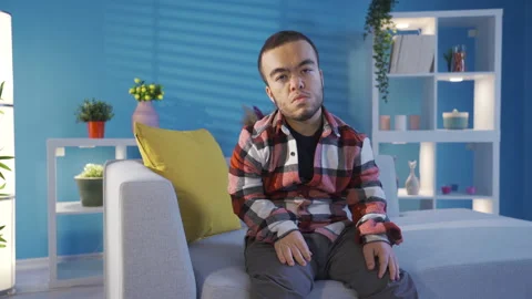 Unhappy dwarf young man thinking and sighing looking at camera. Stock Footage 230971613