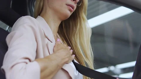 Unhappy female having panic attack in car, suffering chest pain, health problem Stock Footage 166397717