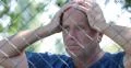 Unhappy Homeless Person Close Metallic Fence Protect Area Immigration Crisis 4k or 4k+ Resolution