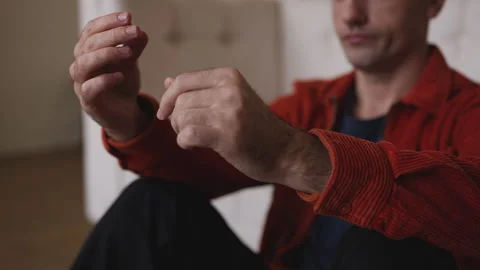 Unhappy man holding wedding ring, thinking about divorce and personal problems Stock Footage 337908297