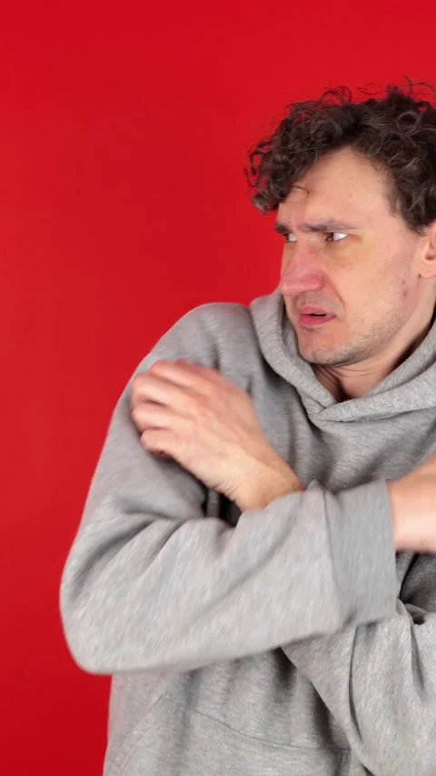 Unhappy man suffers panic attacks, twitches sounds, movements. 動画素材 304761737