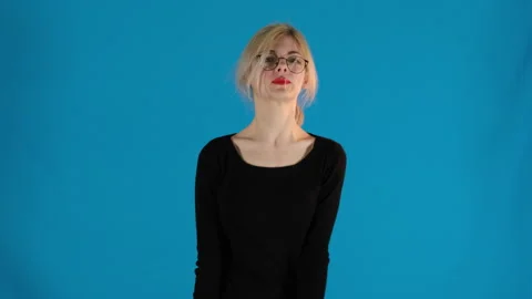 Unhappy model extends hand towards camera turning head away Stock Footage 306481868