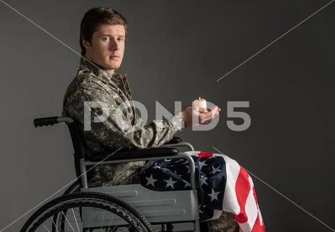 Unhappy paralyzed military man feeling helpless Stock Photos