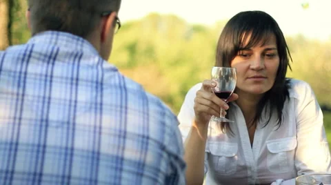 Unhappy, pensive woman on date with man drinking wine, dolly shot HD Stock Footage