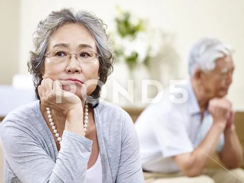 Unhappy senior asian couple Stock Photos