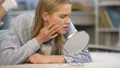 Unhappy teenage girl looking at her problematic skin condition, self-criticism 4k or 4k+ Resolution