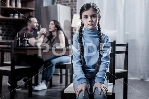 Unhappy young girl looking at you Stock Photos