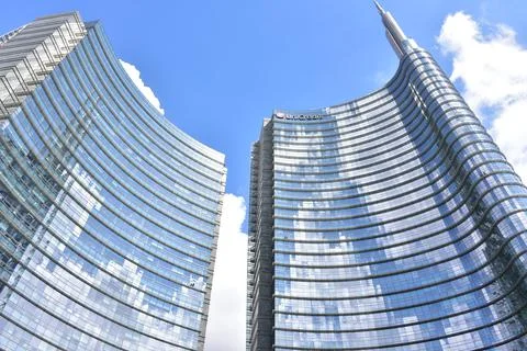 Unicredit Group Tower complex in Gae Aulenti Square on azure sky, Milan, Italy Stock Photos
