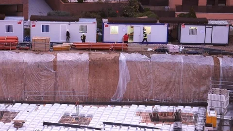 Unidentifiable construction workers working on building site Stock Footage 119330022