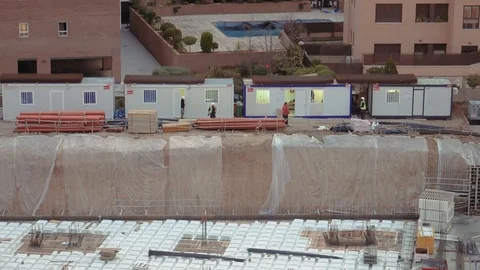 Unidentifiable construction workers working on building site Stock Footage 119387731