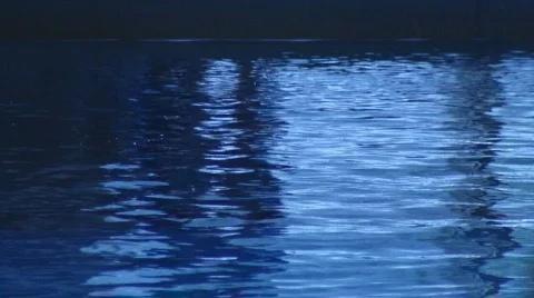 Unidentifiable diver breaks surface of pool Stock Footage 107680