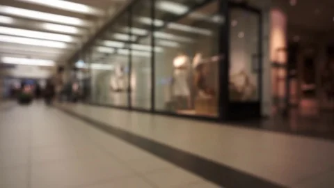 Unidentifiable,unrecognizable,out of focus people going through shopping mall Stock Footage 74016202