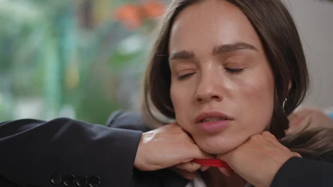 Unidentified assailant strangling a scared young woman from behind Stock Footage 328230806