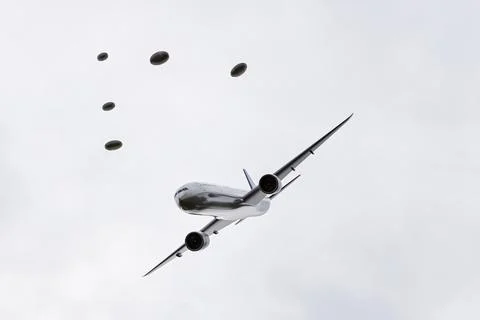 Unidentified flying objects chaising an airplane Stock Illustration