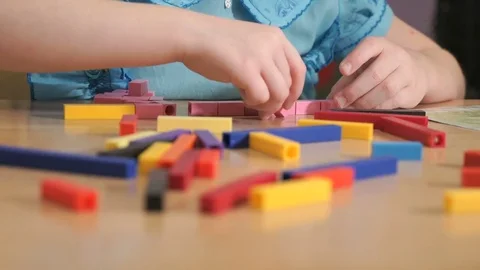Unidentified girl playing in developing designer Stock Footage 81258668