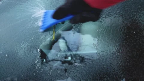 An unidentified hand cleans the car window from ice. Stock Footage 346743952