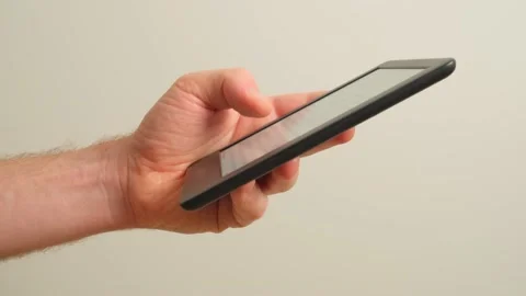 Unidentified man use ebook reader at home Video stock 149142201