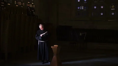 A unidentified monk in the service of reading the Bible Stock Footage 59147210