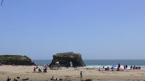 Unidentified people at the Natural Bridges State Beach Stock Footage