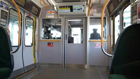 Unidentified train conductors is seen operating train on JR line Stock Footage 99522310