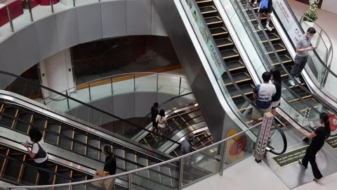 Unidentifield people are using escalators in Shooping mall. Stock Footage 304263916