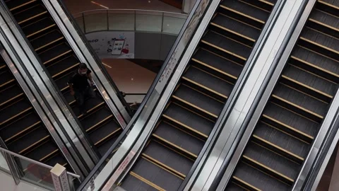 Unidentifield people are using escalators in Shooping mall. Stock Footage 304263999