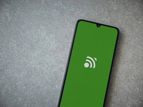 Unified Remote app launch screen on smartphone on ceramic stone background Stock Photos
