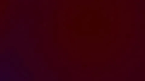 A uniform, deep maroon color gradient. Stock Photos