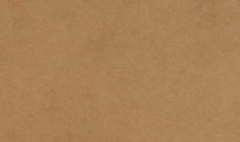 A uniform, light brown background with a subtle, natural paper-like texture.. Stock Photos