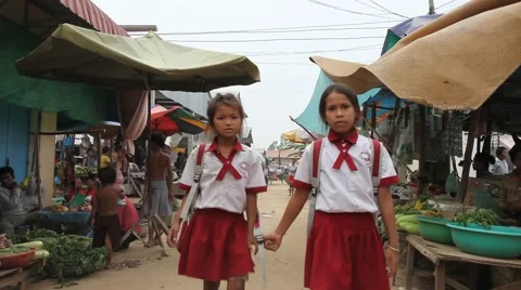Uniformed schoolchildren in poor Asian street market Stock Footage 48004341