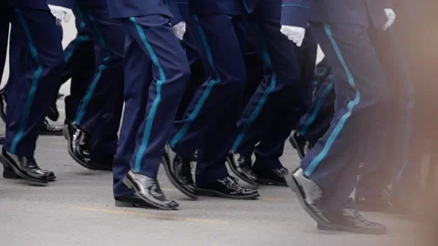 Uniformed service members marching in precise formation during a ceremonial Stock-Footage 317564536