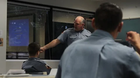Uniformed Students in Foreground Listening to Instructor Stock Footage 40700981