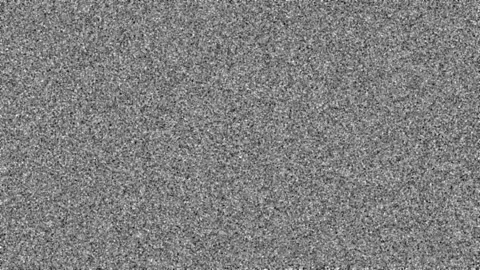 Uniformly distributed film grain in gray color for an analog film look. Stock Footage 163777863