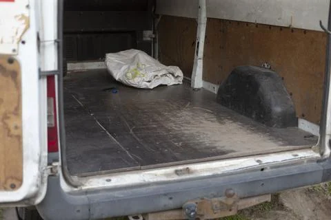 Uninhabited work van interior with tools and scuff marks visible Stock Photos