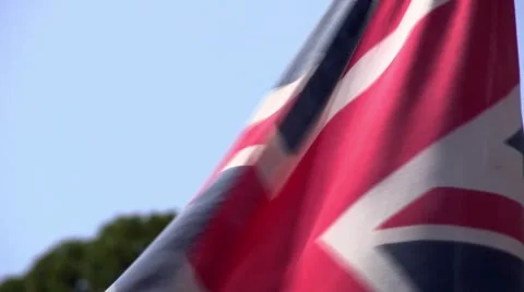Union Flag blowing in the wind on a pole close up Stock Footage 44001586