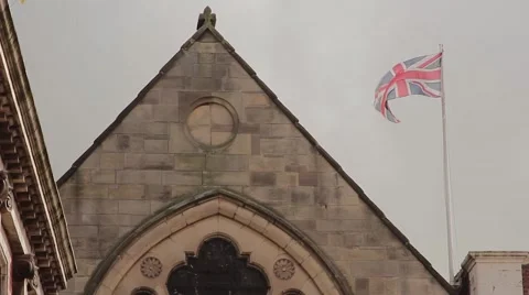 Union Flag Flying Above an old historical building - Lichfield Town Centre 動画素材 42906905