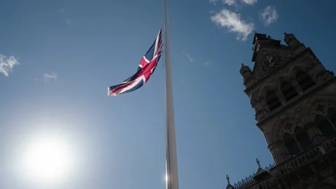 Union flag flying at half mast for the death of Queen Elizabeth II outside Stock Footage 212009798