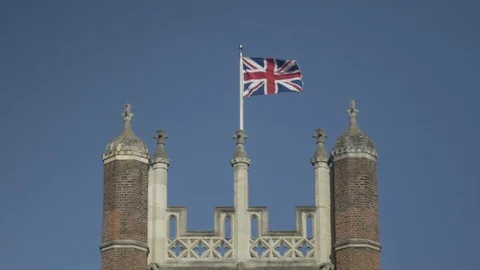 Union Jack flag blowing in the wind at Hampton Court Palace Stock Footage 86749155