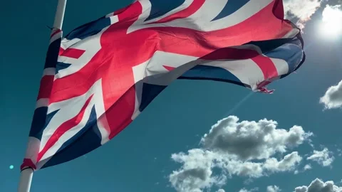 Union Jack flag blowing in the wind Stock Footage 219325680