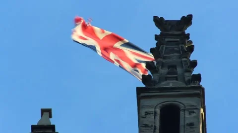 Union Jack Flag Flying Beside Bell Tower of St Mary's Church in Warwick, UK Видео 346928472