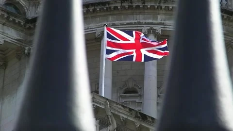 Union Jack Flag Flying in Front of British Classical Architecture 4K Stock-Footage 332135569