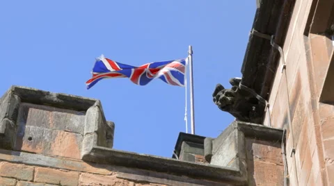 Union Jack Flag Flying on Old Building Stock Footage 44098674
