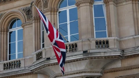 A Union Jack Flag Flying In The Wind, London, UK Stock Footage 240233890