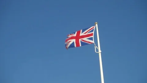 A Union jack flag flying on a windy day Stock Footage 80391115
