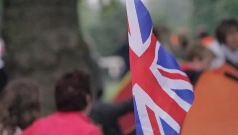 Union Jack Flag in front of crowds on the Mall before the Royal Wedding Stock Footage 5034842