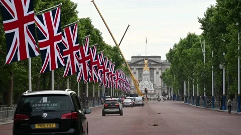 Union Jack flags along the Mall in London up to Buckingham Palace for Jubilee Stock Footage 195886561