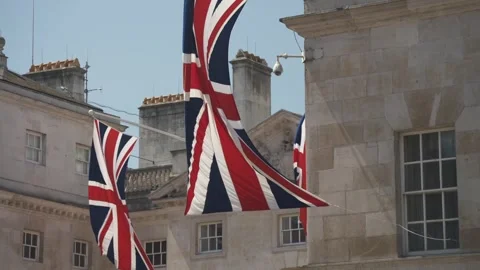 Union Jack flags and Dover House, Whitehall, Westminster, London, England Stock Footage 243036963
