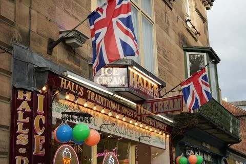 Union Jack Flags And Hall's Sweet Shop Facade In Matlock Bath, Derbyshire, Stock Photos