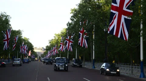 Union Jack flags and traffic in The Mall London Stock Footage 24741352