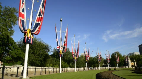 Union Jack flags around Buckingham Palace London Stock Footage 24740498